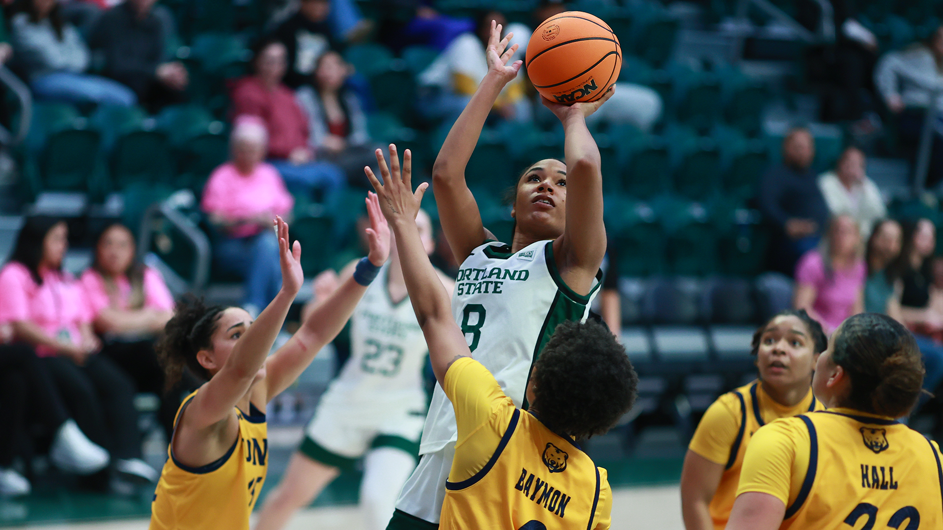 Portland State women's basketball player Cici Ellington rises for a jumper over several Northern Colorado defenders.