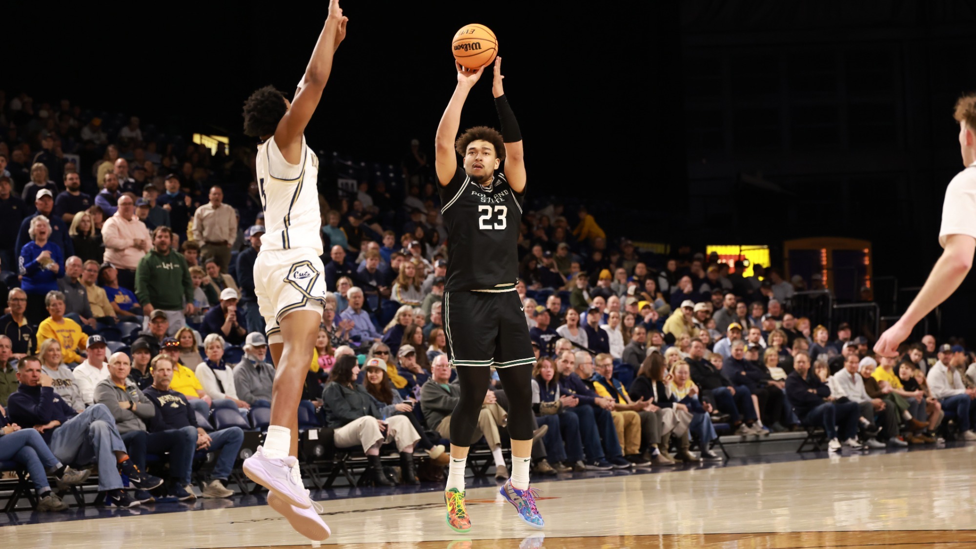 Terri Miller Jr. shoots a three-pointer against Montana State