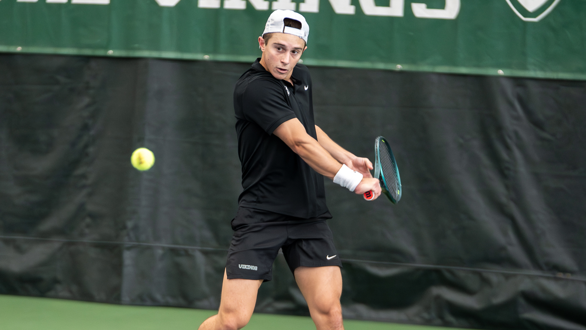 Ignacio Ruiz returning a shot vs. George Fox