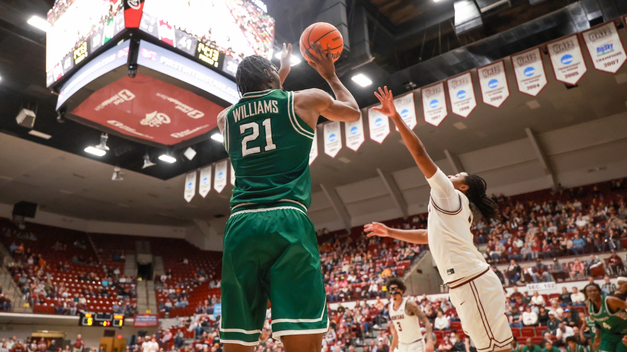Isaiah Williams pulls up for a three-pointer against Montana