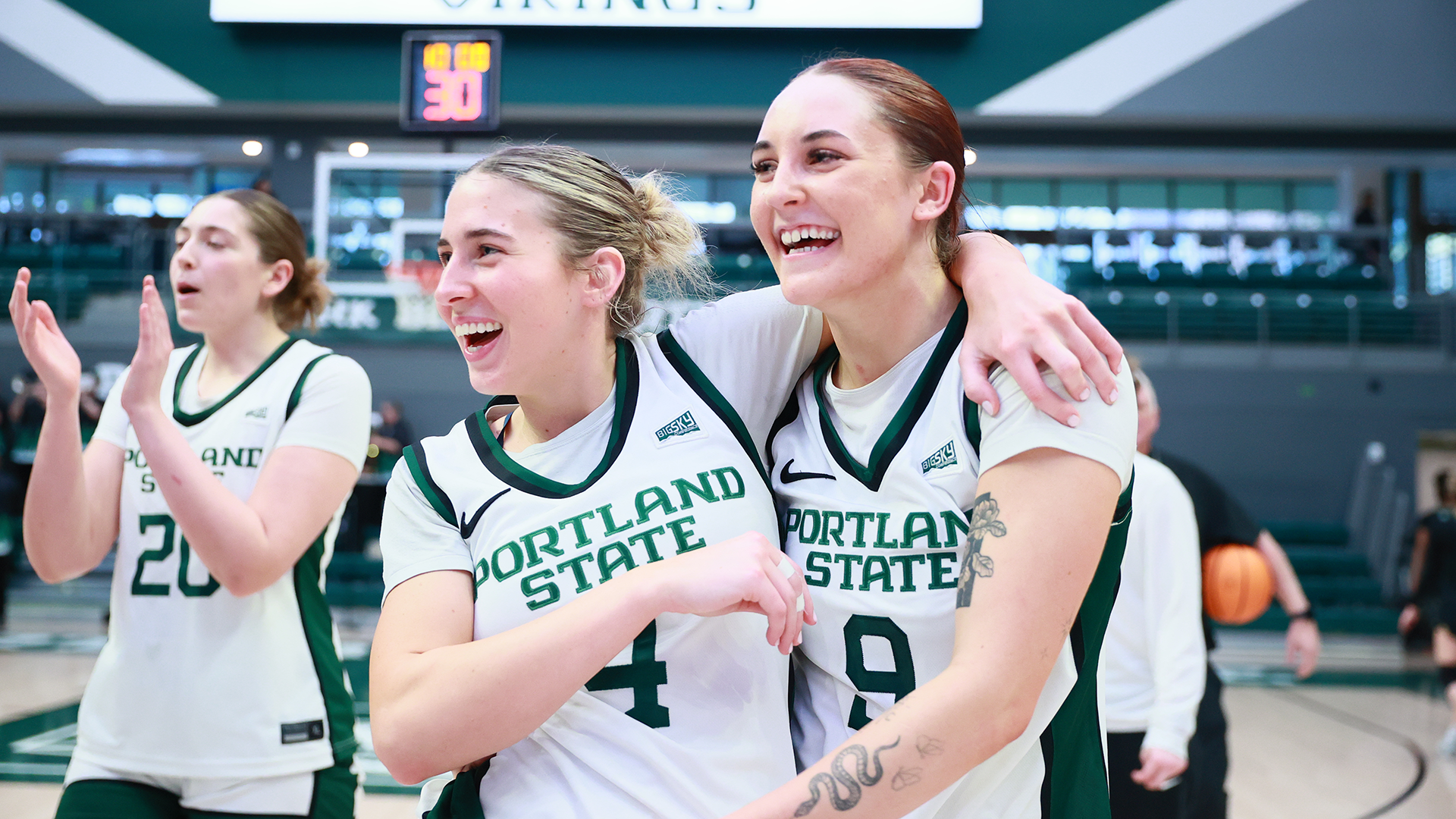 Portland State women's basketball players Hannah Chicken and Sophie Buzzard celebrate the Vikings' victory over Sacramento State together.