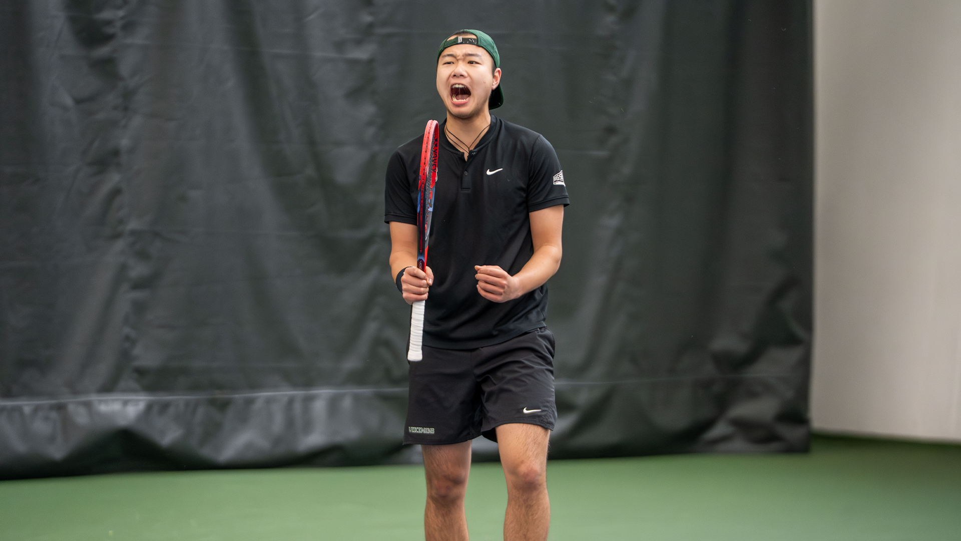 Luke Lu celebrates point against Montana State