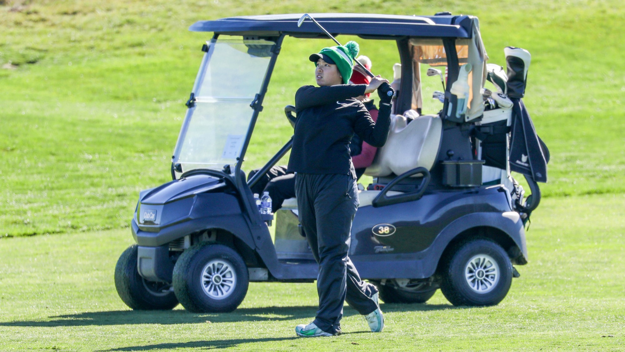 Cynthia Ong hits an iron shot