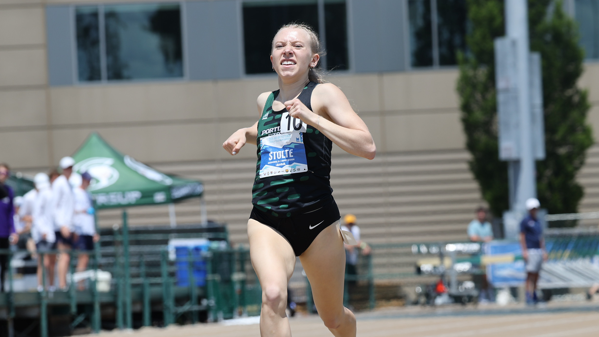 Portland State track & field runner Emma Stolte grimaces as she pushes to the finish line at the 2025 Big Sky Outdoor Championships.