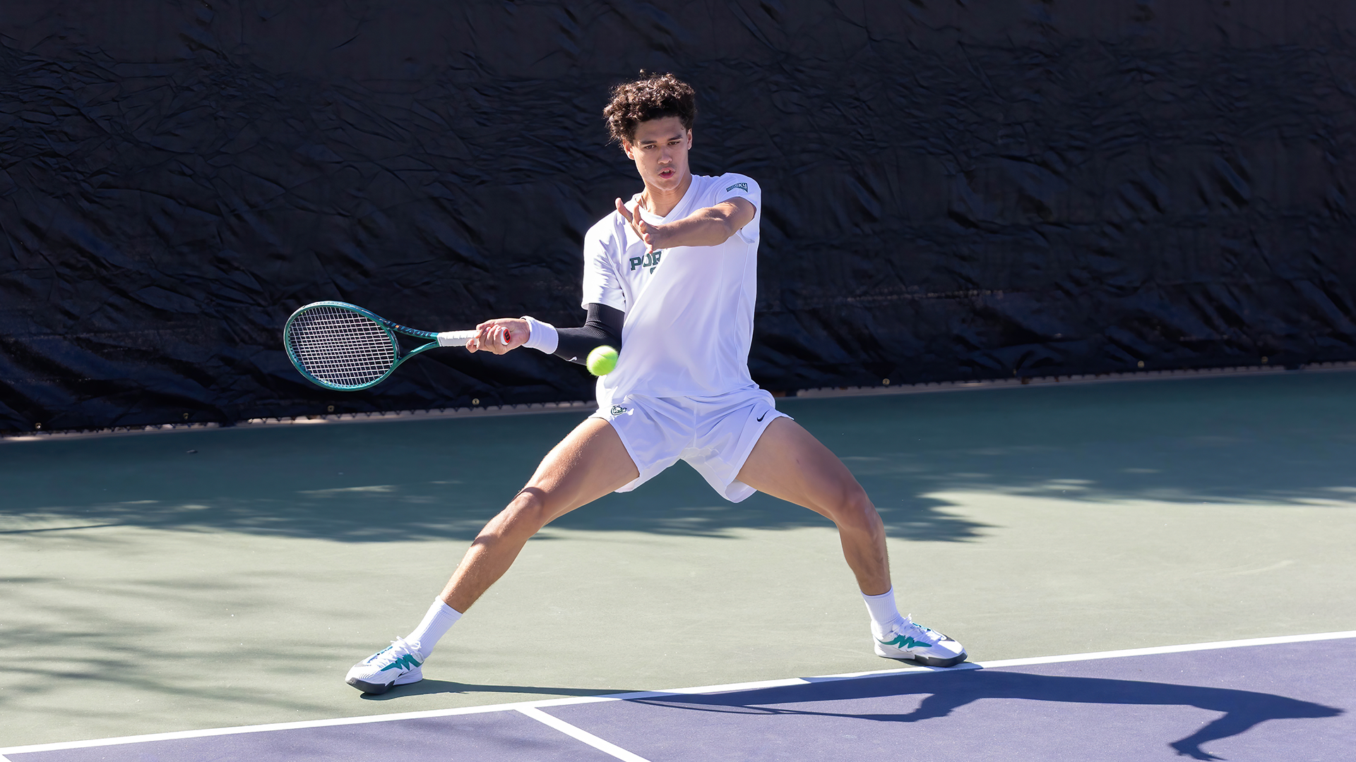 Maas Schotanous swings at a shot against Weber State 
