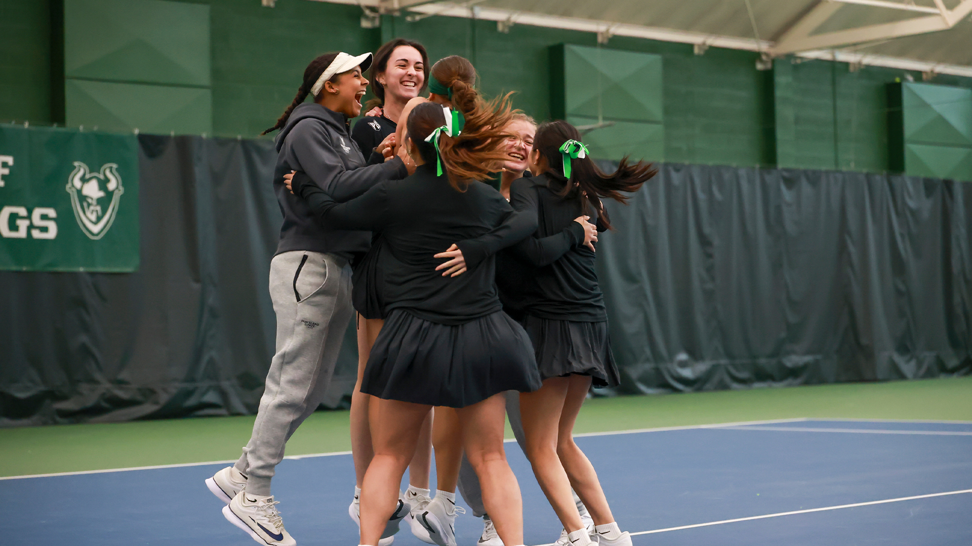 women's tennis team celebrates win over Idaho 