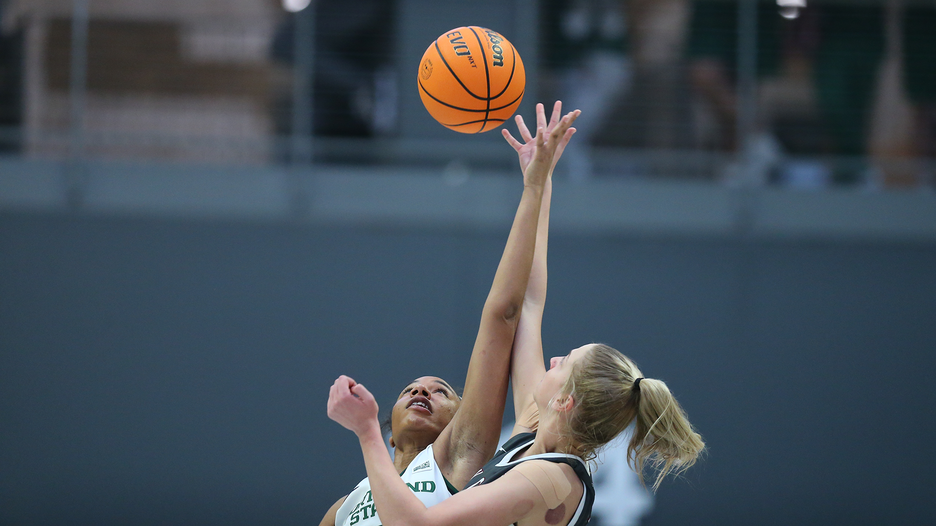 Portland State women's basketball player Cici Ellington jumps for the ball at tipoff against Montana.