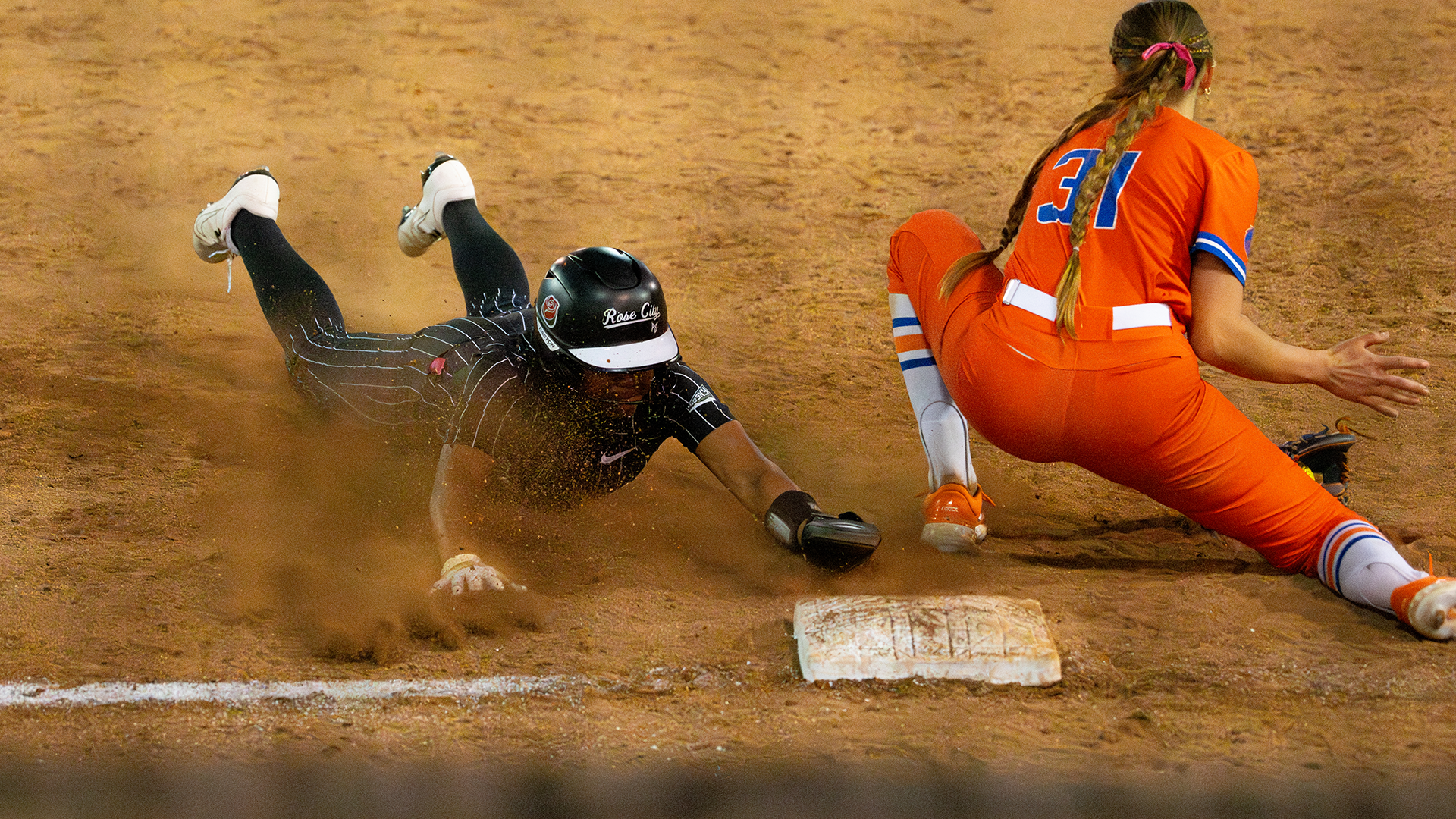 Grace Johnson slides head first into third base against Boise State