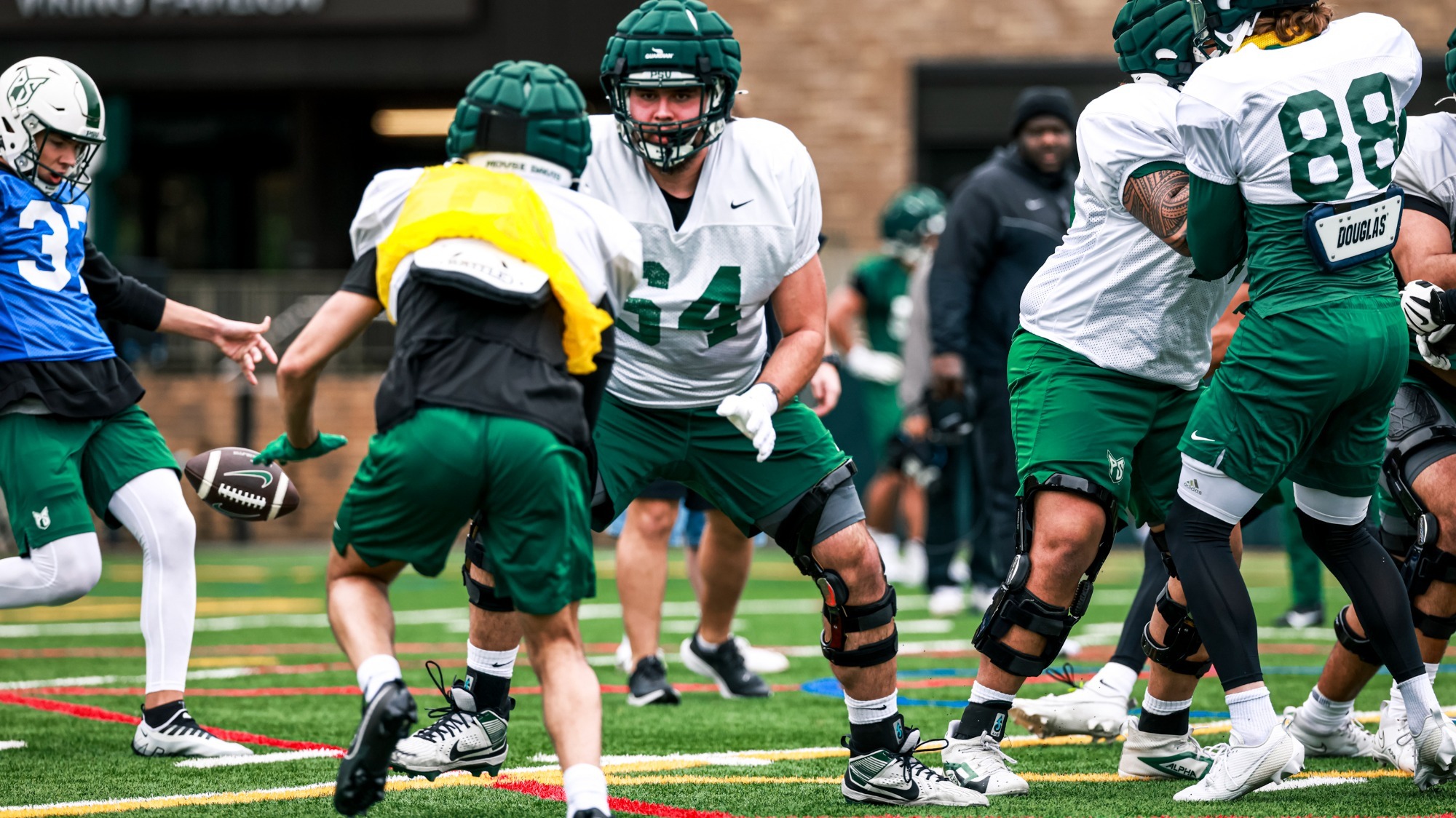 Offensive Lineman Tristan Lewis works a drill in football practice