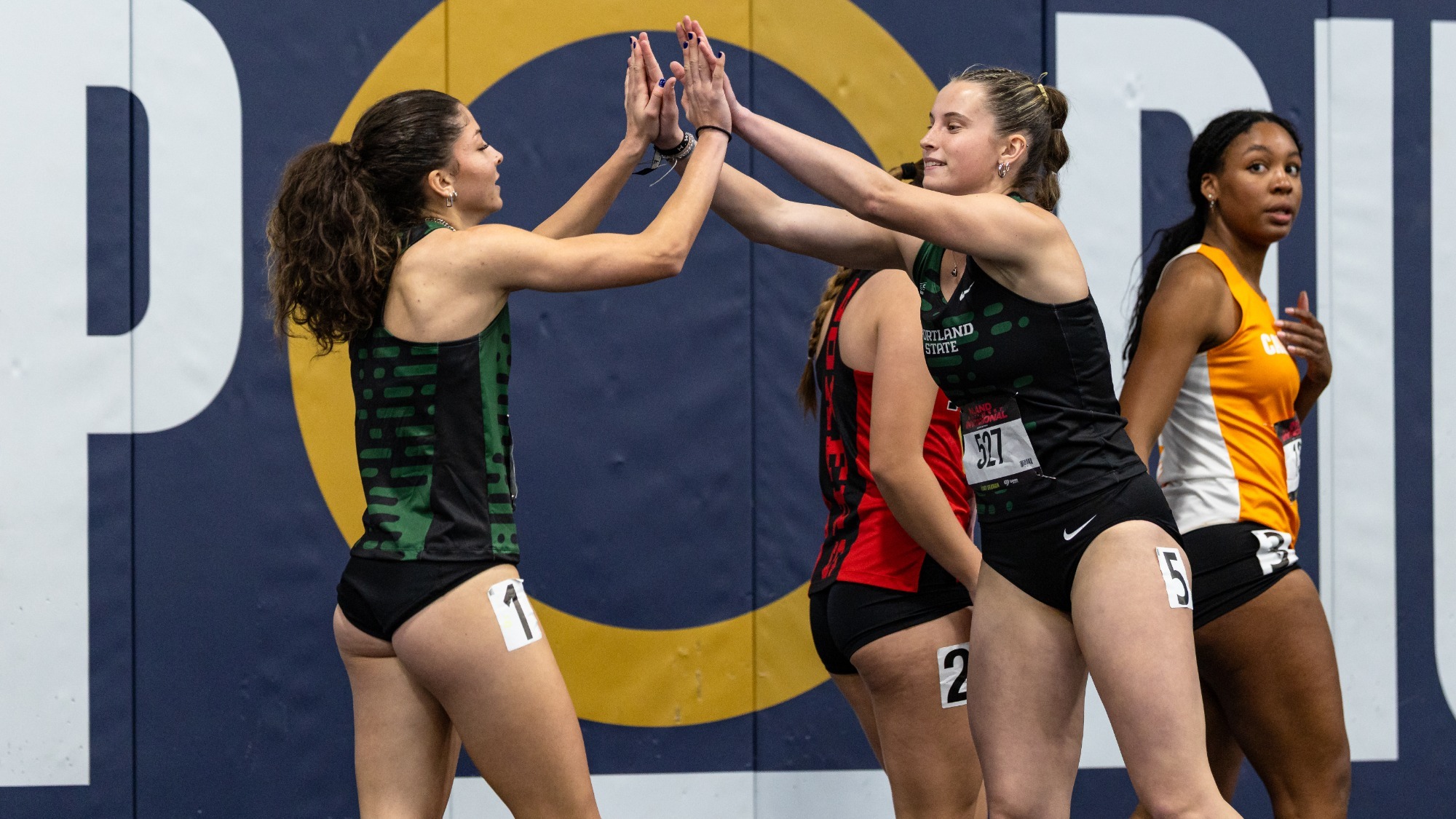 Indoor Track Athletes Ocean Rideout and Ashley Peterson celebrate together. Both were named Academic All-Big Sky Conference.