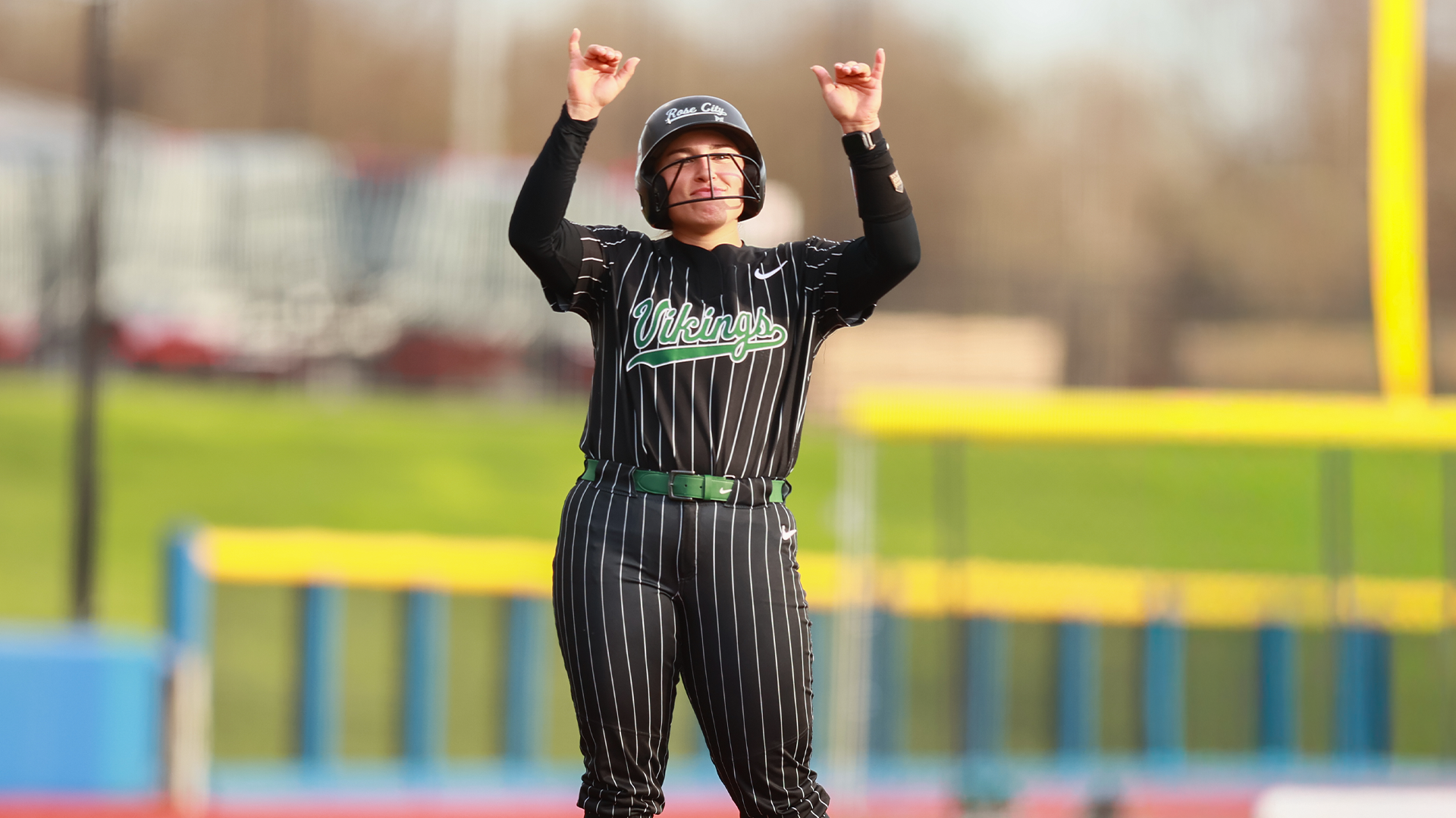 Breanna Lutz celebrates a base hit 