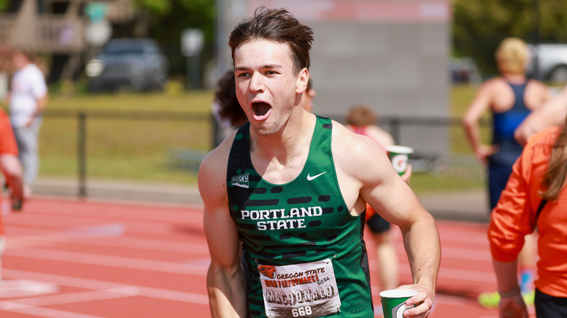 Portland State runner Jack Macdonald celebrates his new school record in the men's 200 meters at the OSU High Performance Meet