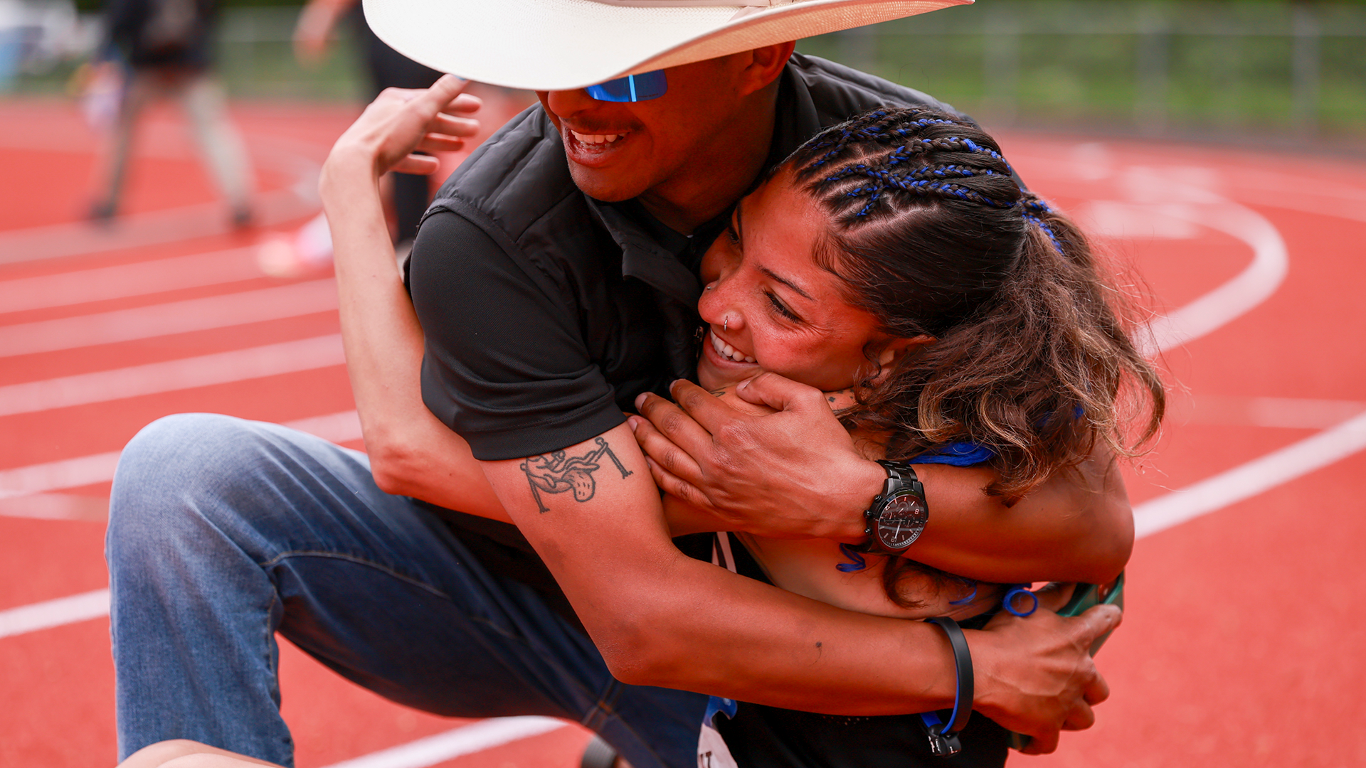 Portland State track & field athlete Ocean Rideout hugs assistant coach Nick Merillana after placing seventh in the heptathlon at the Big Sky Outdoor Championships.