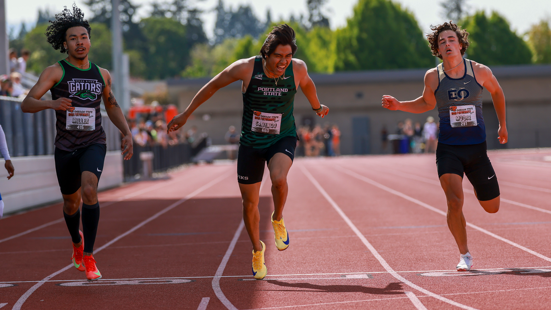 Portland State track & field runner Isaiah Cadengo leans at the line while competing in the 100 meters at the OSU High Performance Meet.