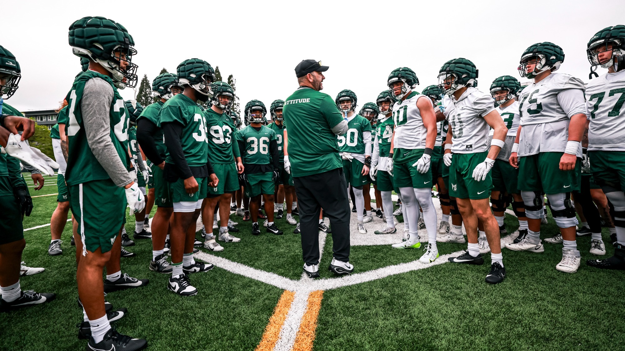 Head Coach Chris Fisk talks to his team during spring practice