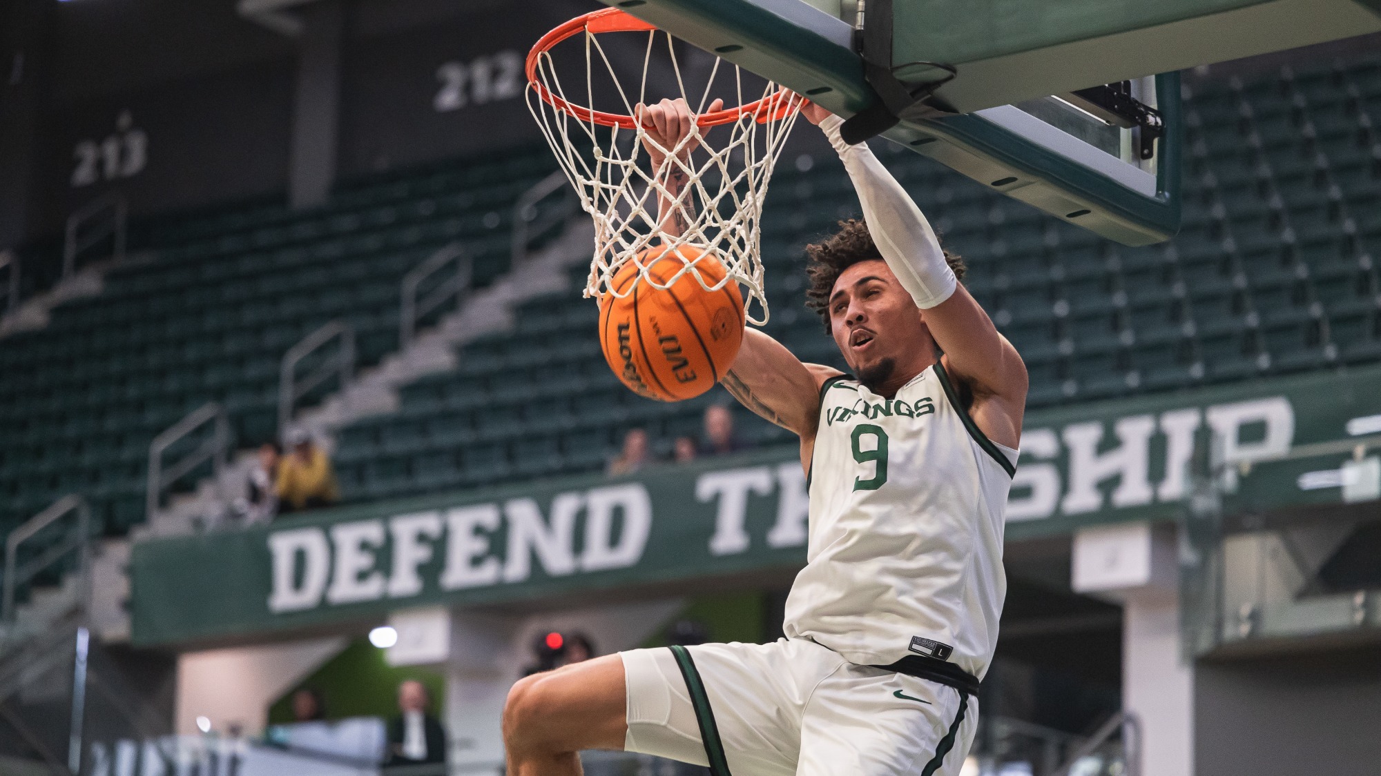 Viking basketball forward Isaac Brice dunks in a game during the 2024-25 season.