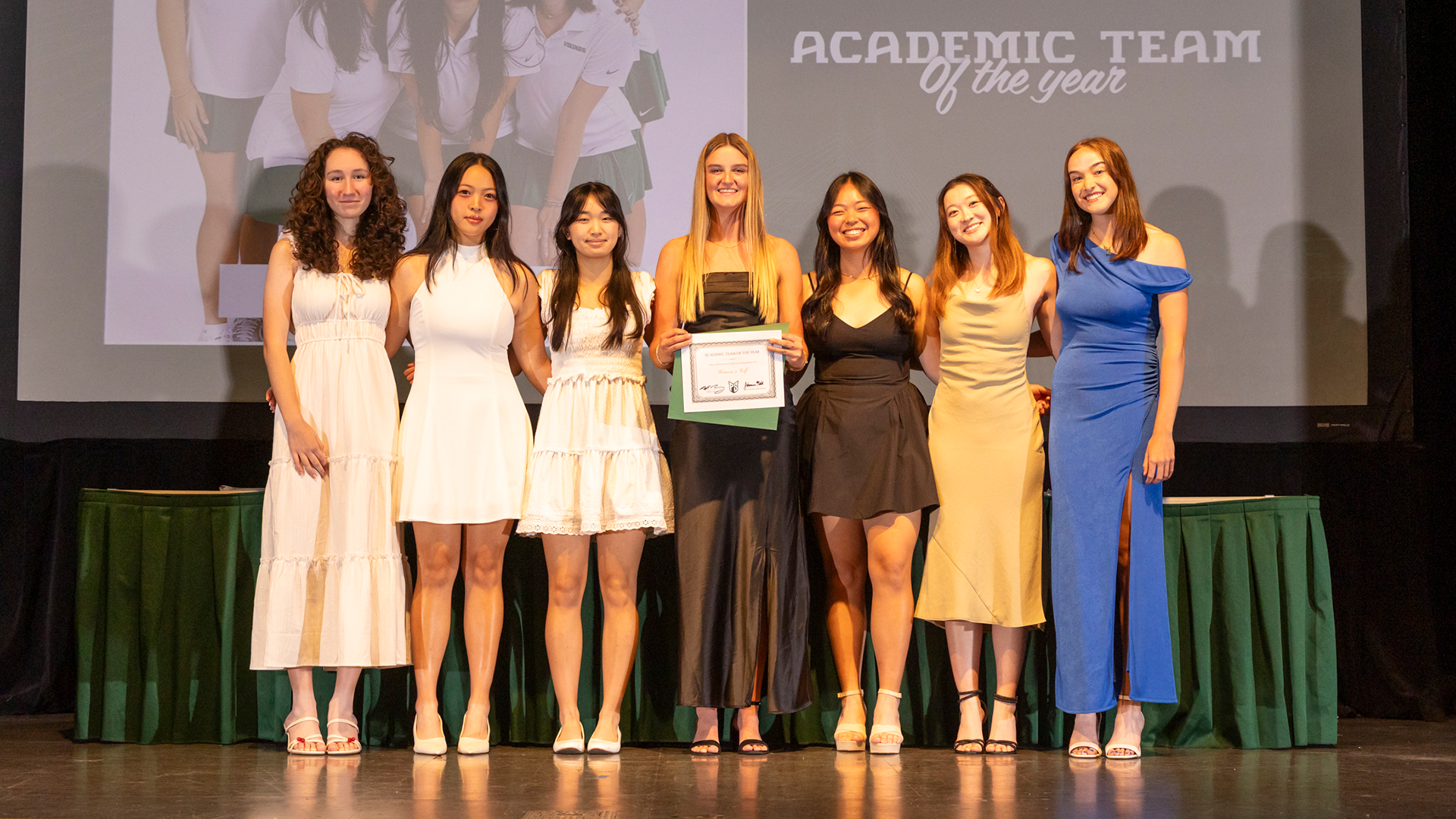 The Portland State women's golf team accepts the Women's Academic Team of the Year at the annual Vik Night award show.