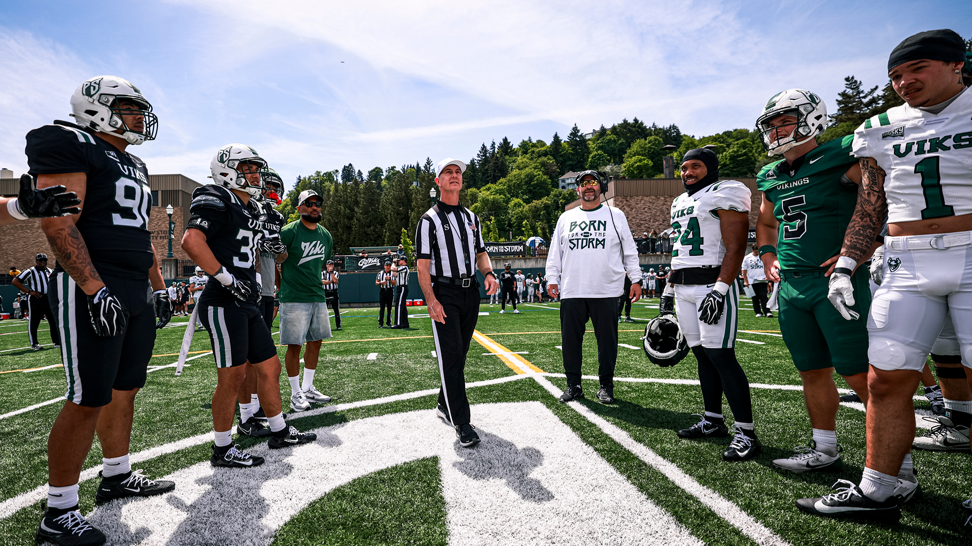 Portland State football players and coaches gather for the coin toss ahead of their Spring Game