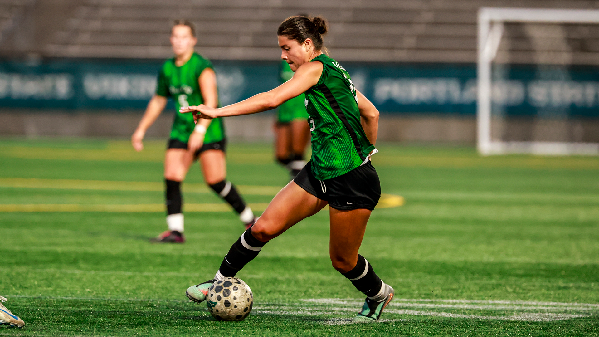 Portland State women's soccer player Aliayha Saldana dribbles past an Oregon defender in the Vikings' season opener against the Ducks.
