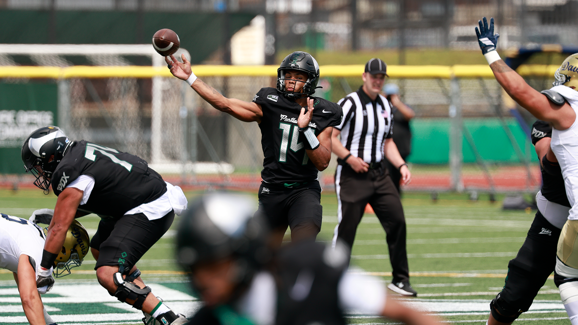 Portland State quarterback Tyrese Smith throws to a receiver during the Vikings' season opener against UC Davis.