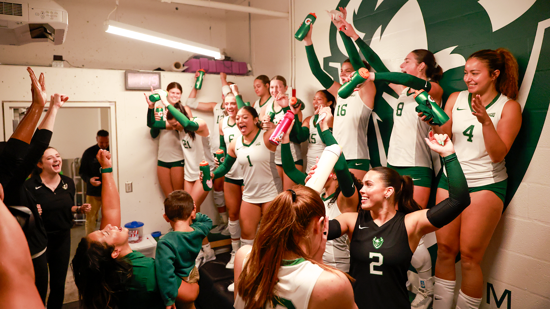 The Portland State volleyball team celebrates its five-set win over Nevada in its locker room afterwards.