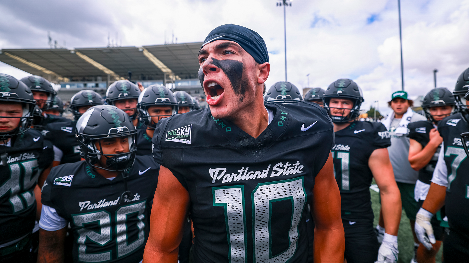 Portland State football captain Tanner Beaman leads the team in a pre-game huddle before their season opener against UC Davis.