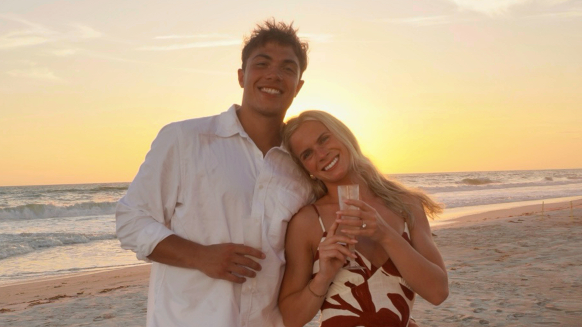 Photo after Portland State football player Tanner Beaman proposed to track & field athlete Tori Forst