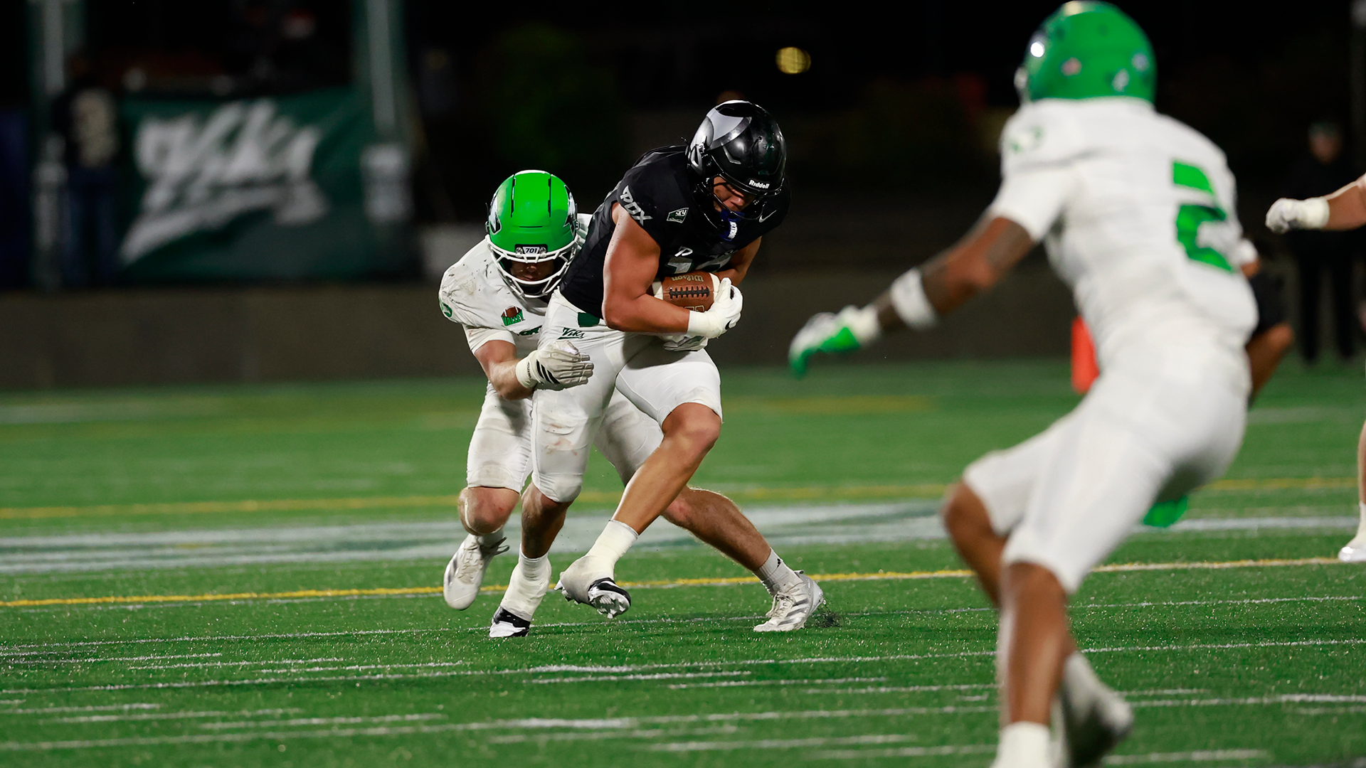Portland State football player Tanner Beaman fights for extra yards after catching a pass during the Vikings' home game against North Dakota.
