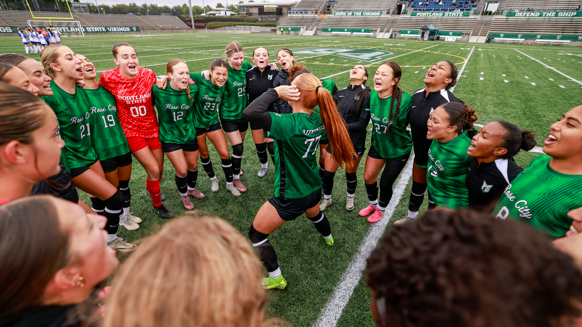 The Portland State women's soccer team gathers around Sydney Spotts for a pre-game circle.