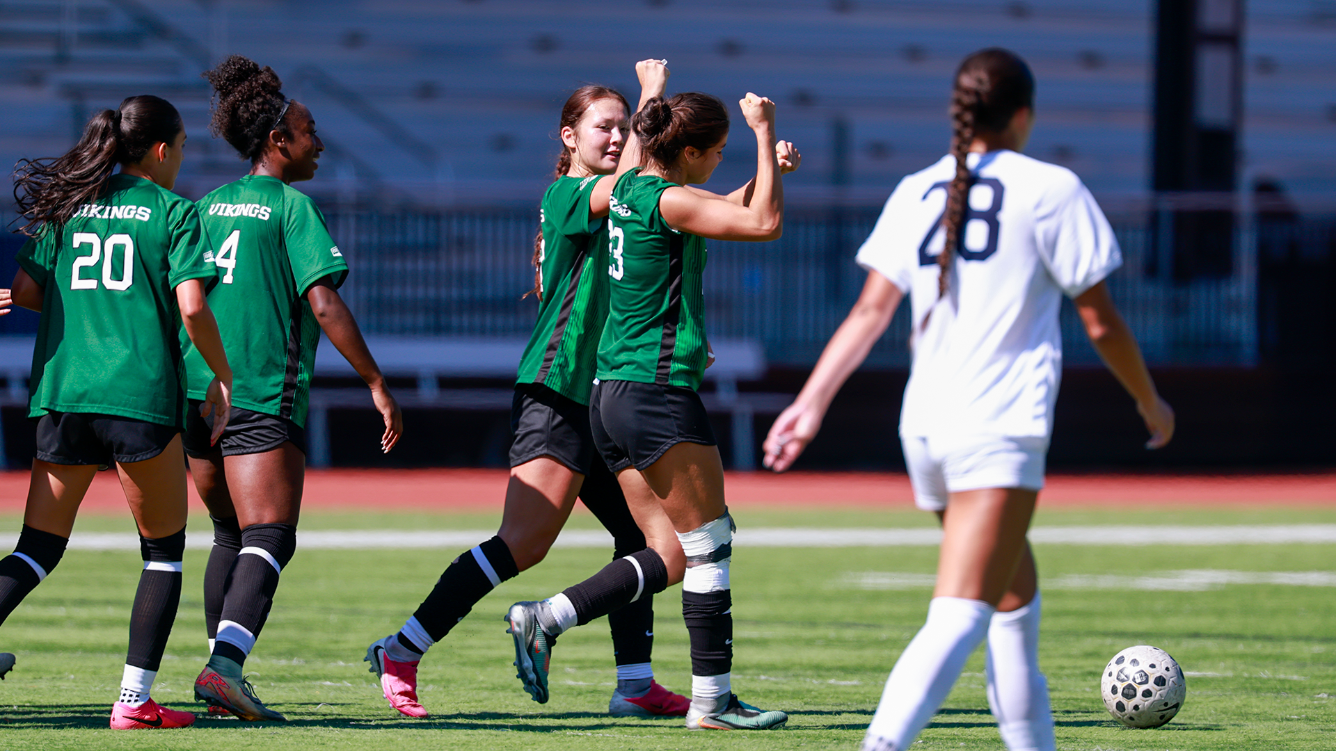 Portland State women's soccer players celebrate around Aliayha Saldana following her game-winning goal against San Diego.
