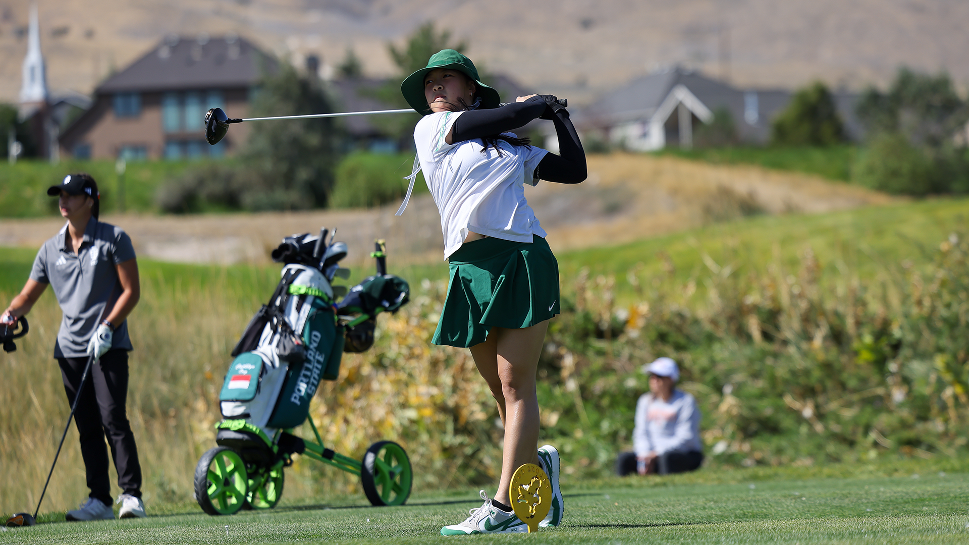 Portland State women's golfer Caithlyn Ong swings through a drive at the Wolverine Invitational