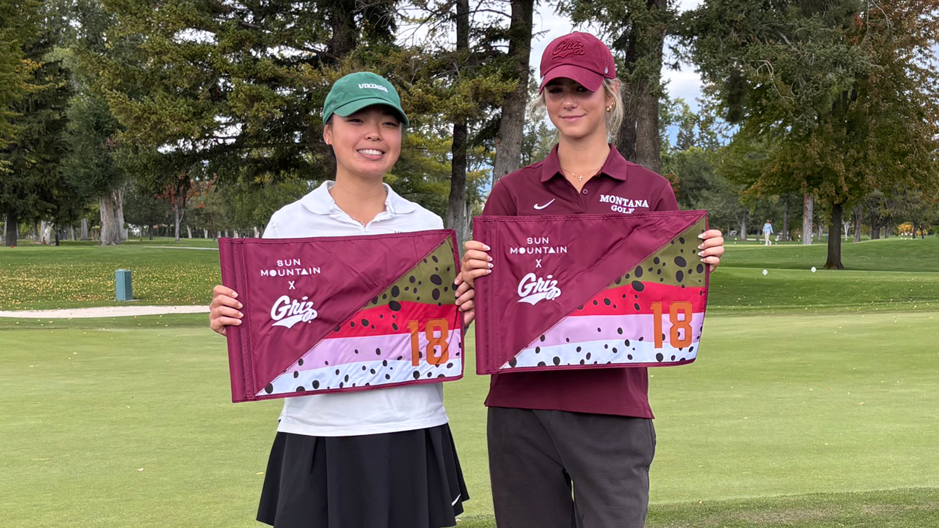 Portland State women's golfer Cynthia Valerie Ong poses with Montana's Zoe Bar-Or after the pair tied for medalist honors at the Sun Mountain Intercollegiate.