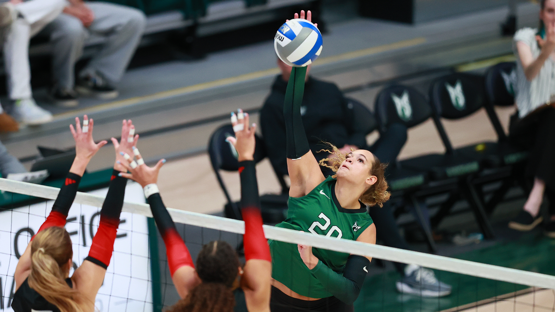 Portland State volleyball player Willow Watson hits a ball over the net during the Vikings' home match against Southern Utah.