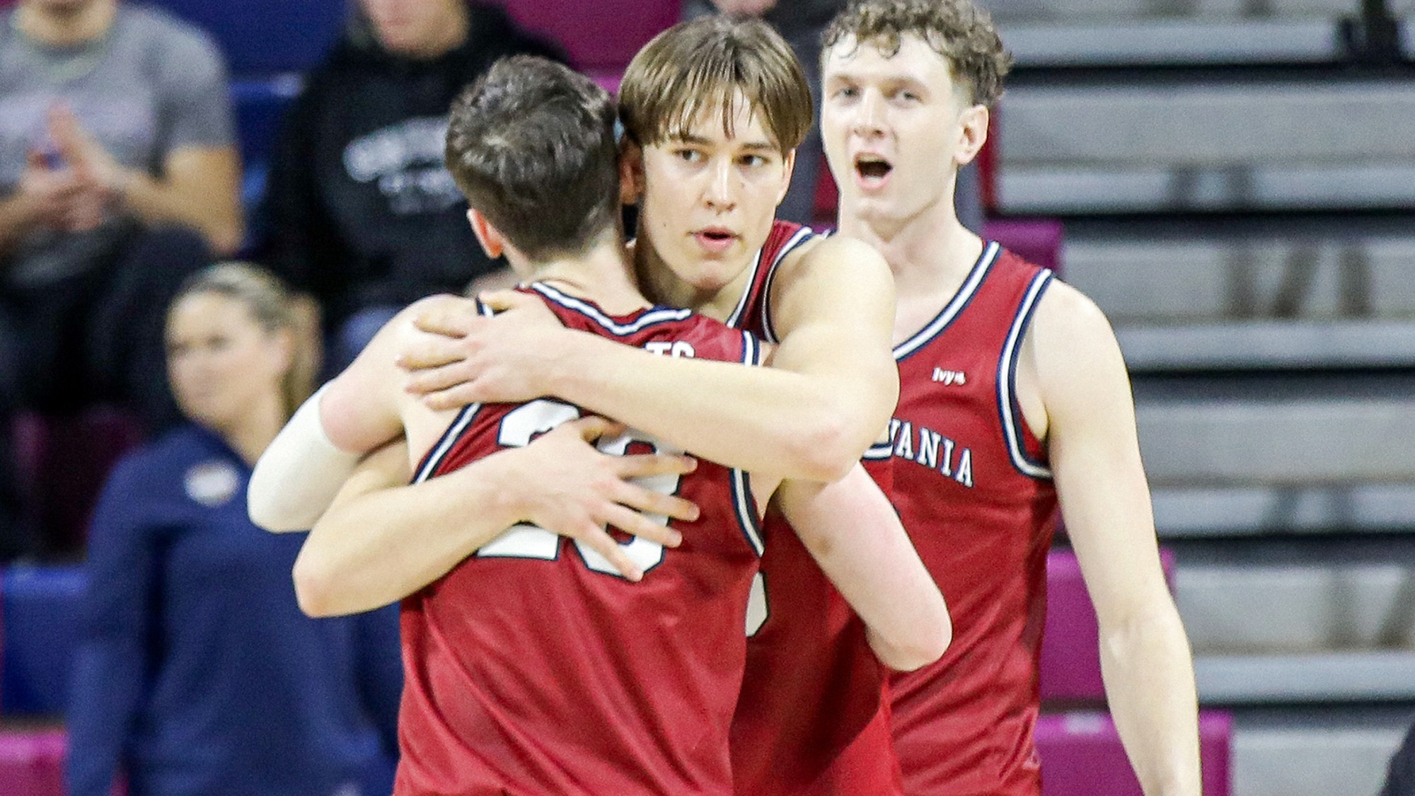 Augie Gerhart hugs Ethan Roberts with TJ Power behind him vs. Brown 01-10-2026