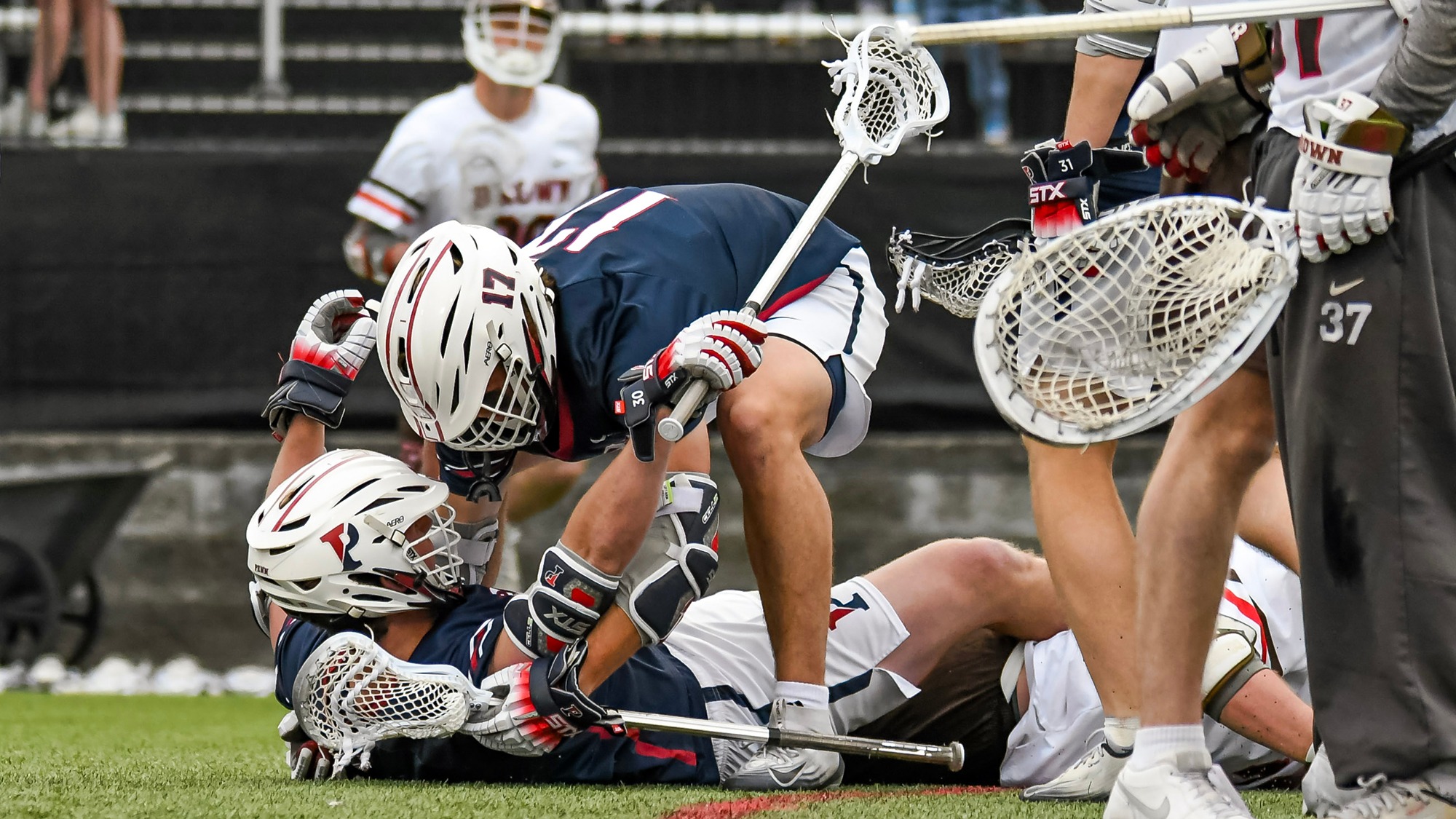 Ben Beacham (17) celebrates Nate Lucchesi's 2OT goal at Brown 04-18-2026