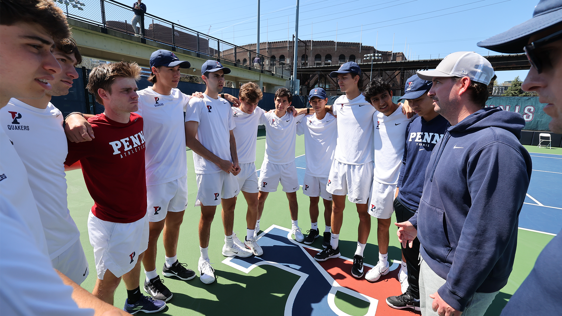 Men's tennis team huddle