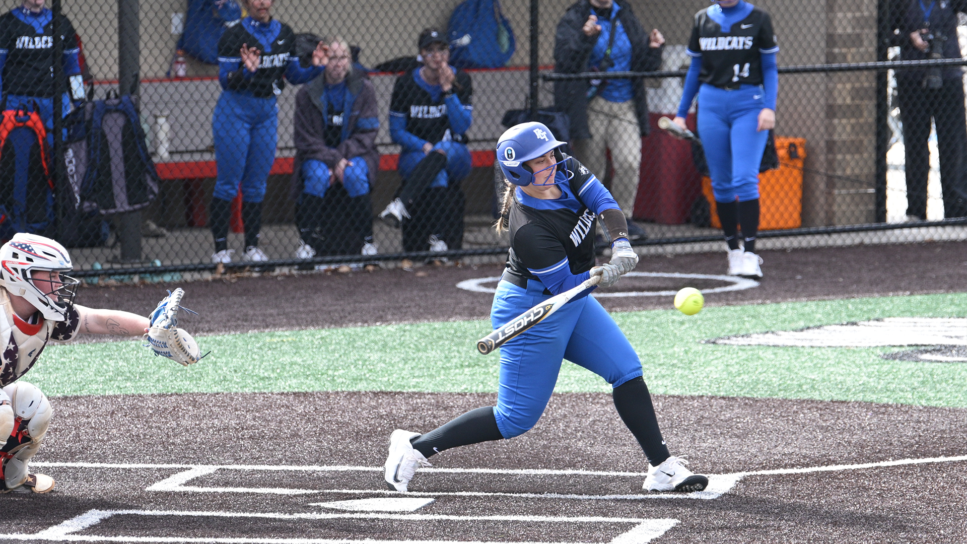 Penn College softball player swinging at a pitch