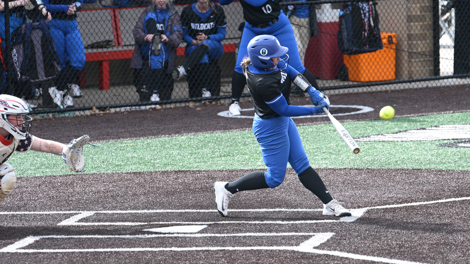 Penn College softball player swinging at a pitch
