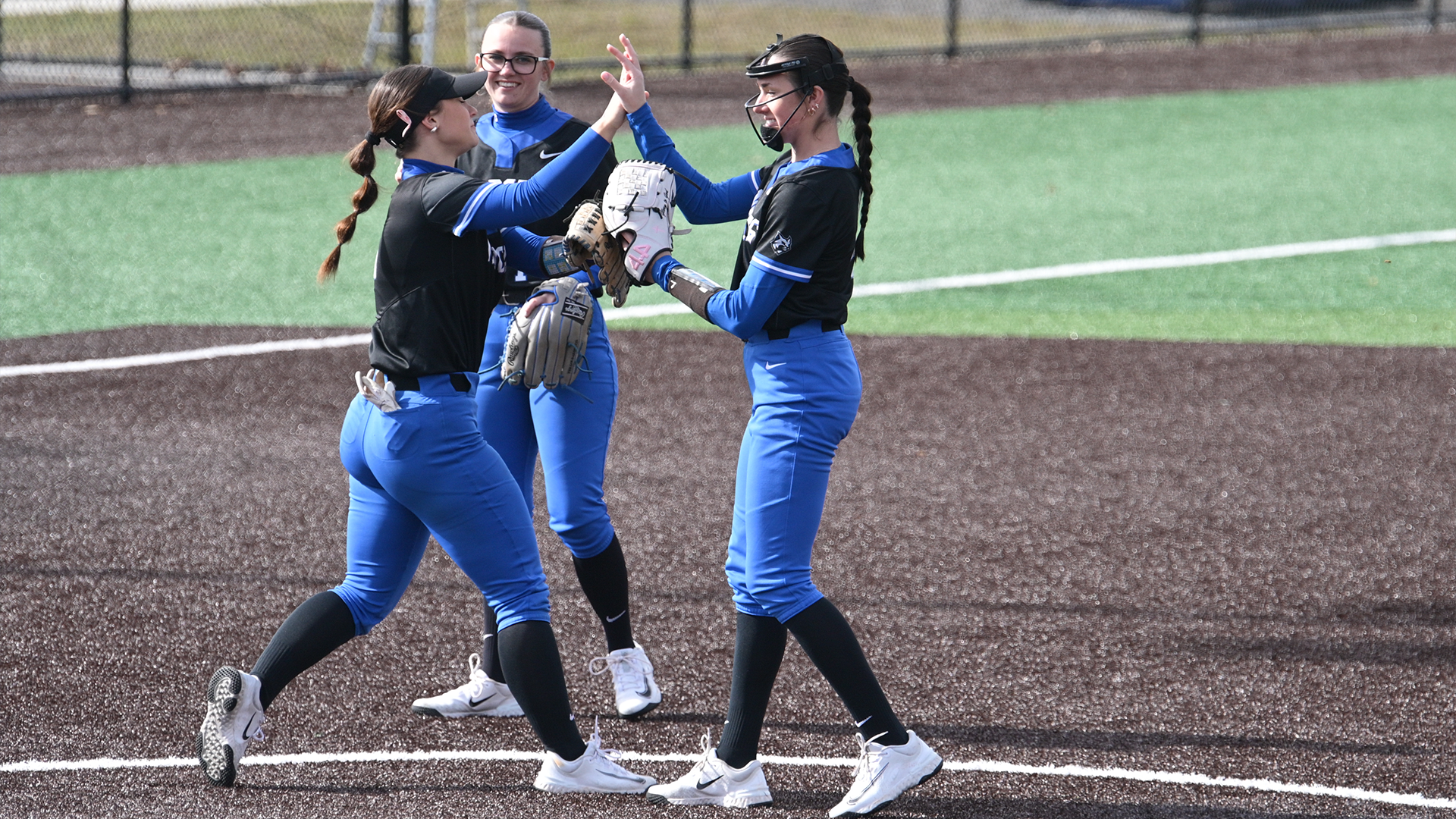 Penn College softball players giving high-fives