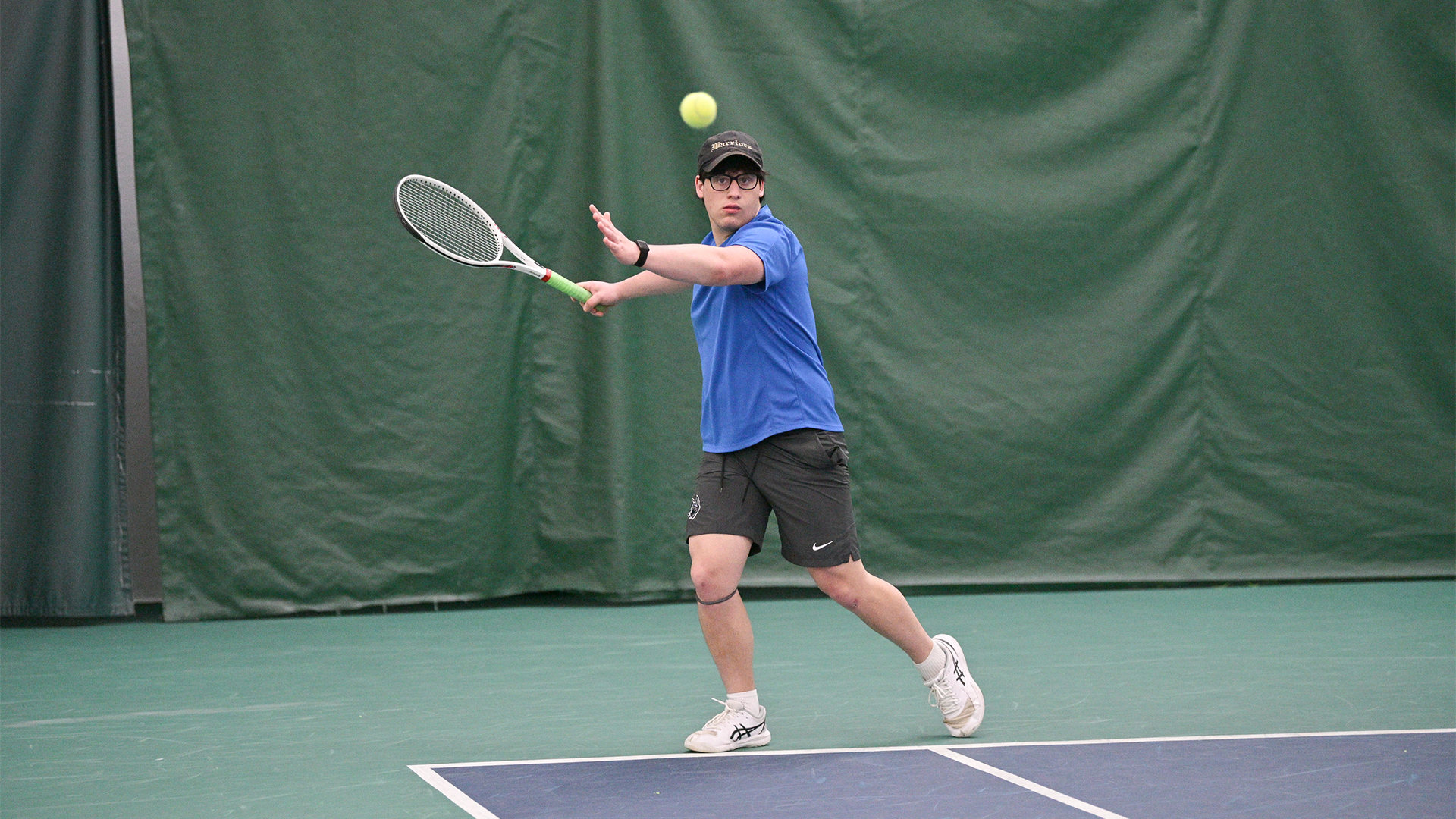 Penn College men's tennis player in action during a match against St. Mary's