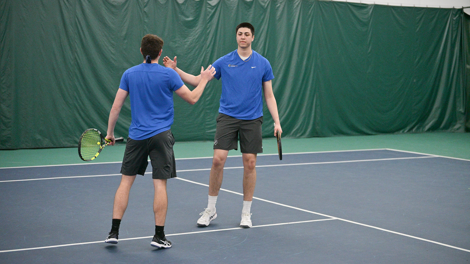 Penn College men's tennis player in action during a match against St. Mary's