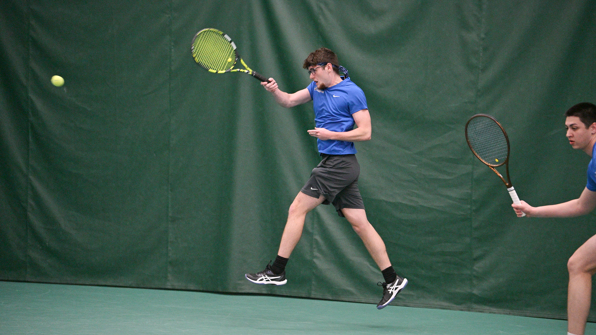Penn College men's tennis player in action during a match against St. Mary's