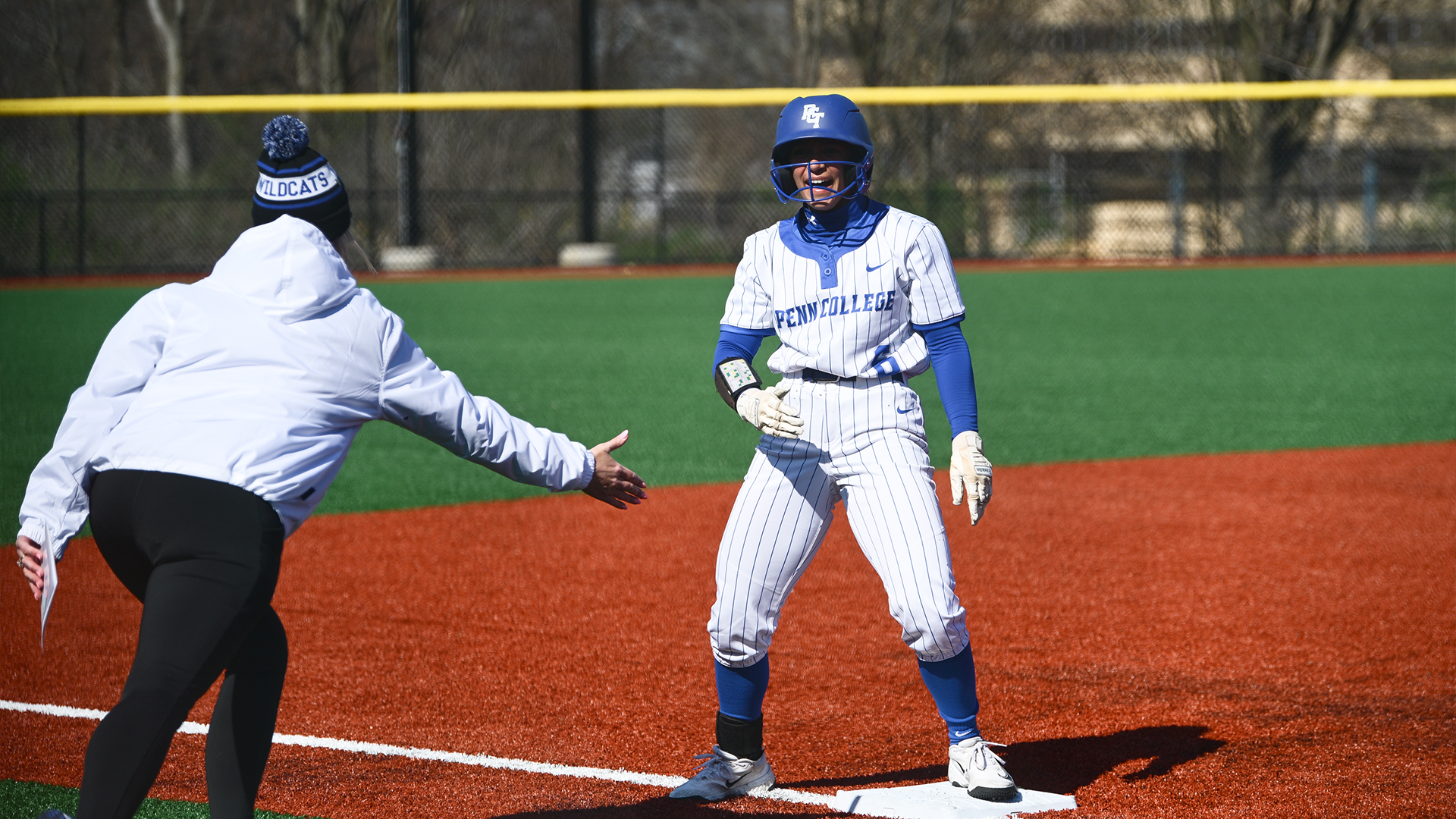 Penn College softball player in action during a doubleheader against Penn State Abington