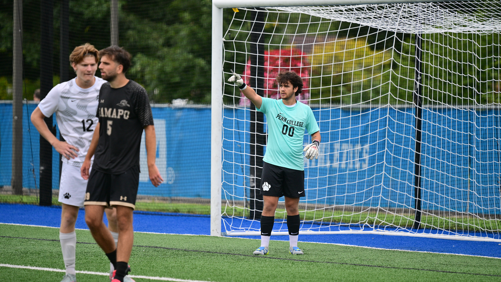 Penn College men's soccer players in a game against Ramapo