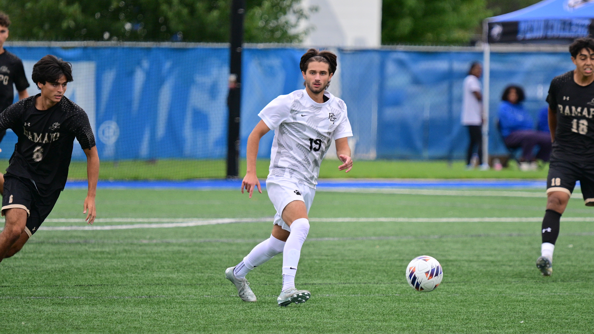 Penn College men's soccer players in a game against Ramapo