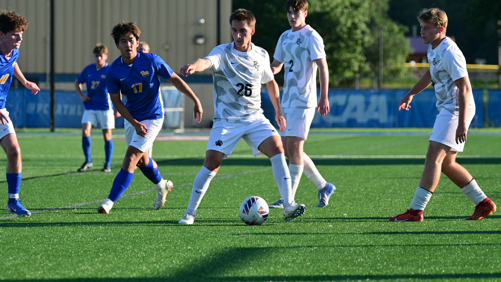 Penn College men's soccer playing in a game against Pitt-Bradford