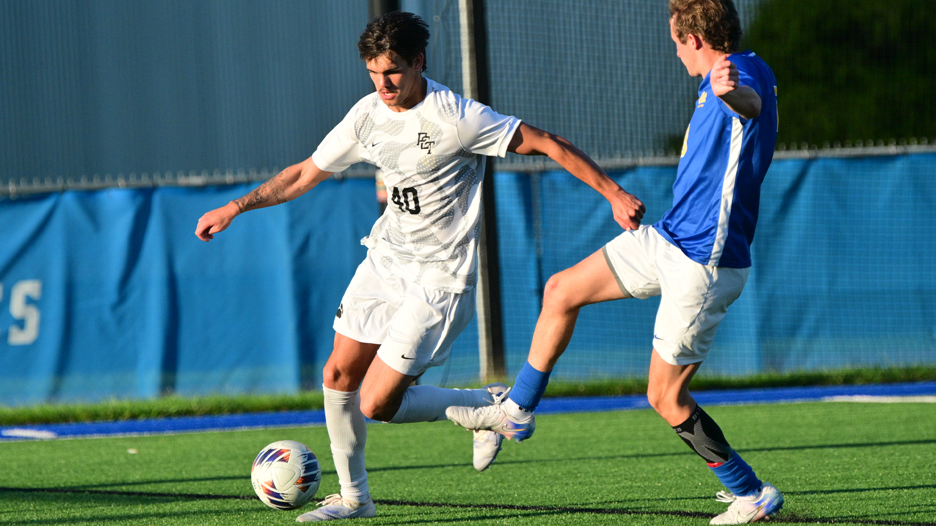 Penn College men's soccer playing in a game against Pitt-Bradford