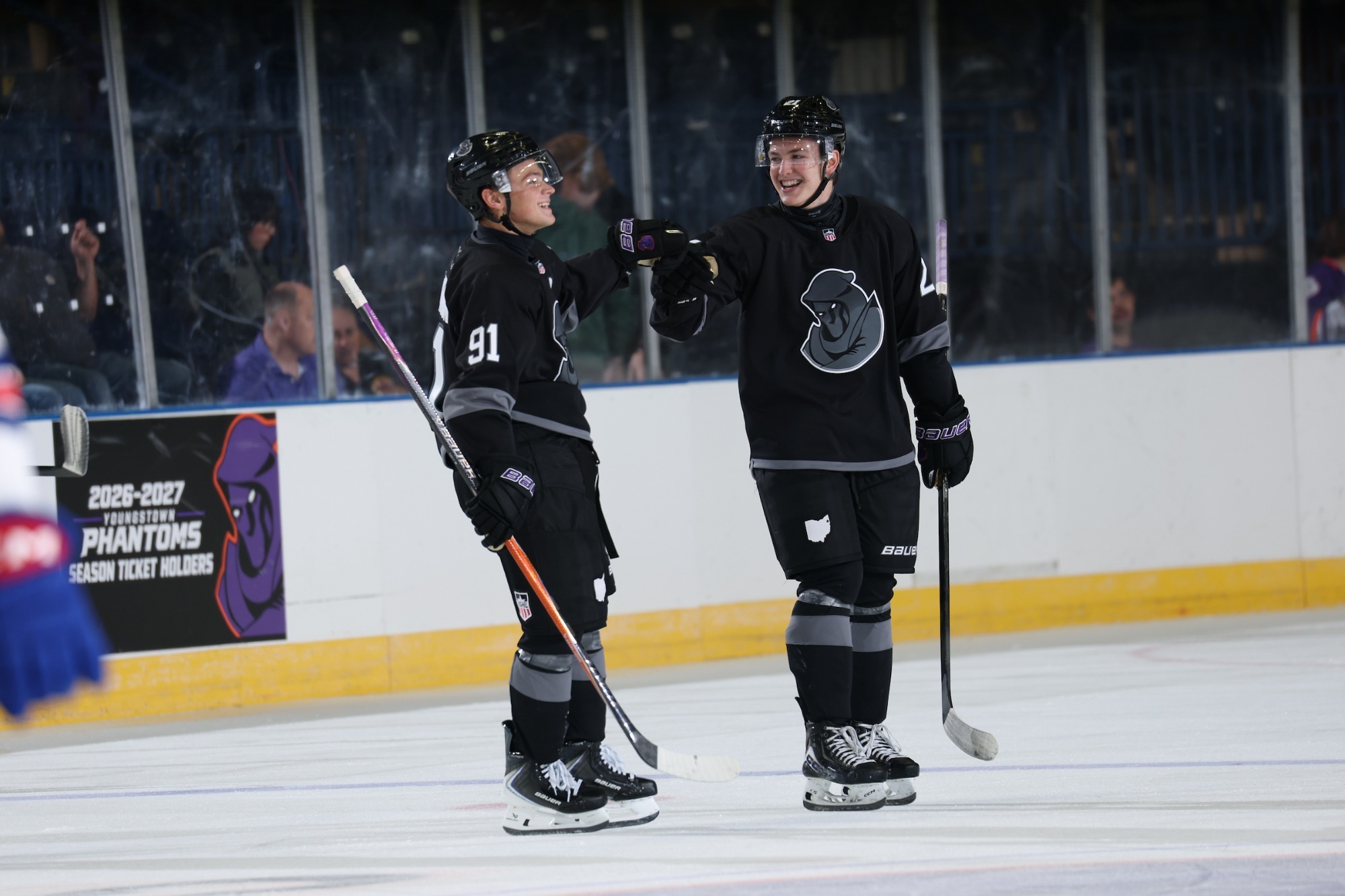 MALACHI MCKINNON AND STEPHEN COVER SHARE A FIST BUMP AFTER A GOAL