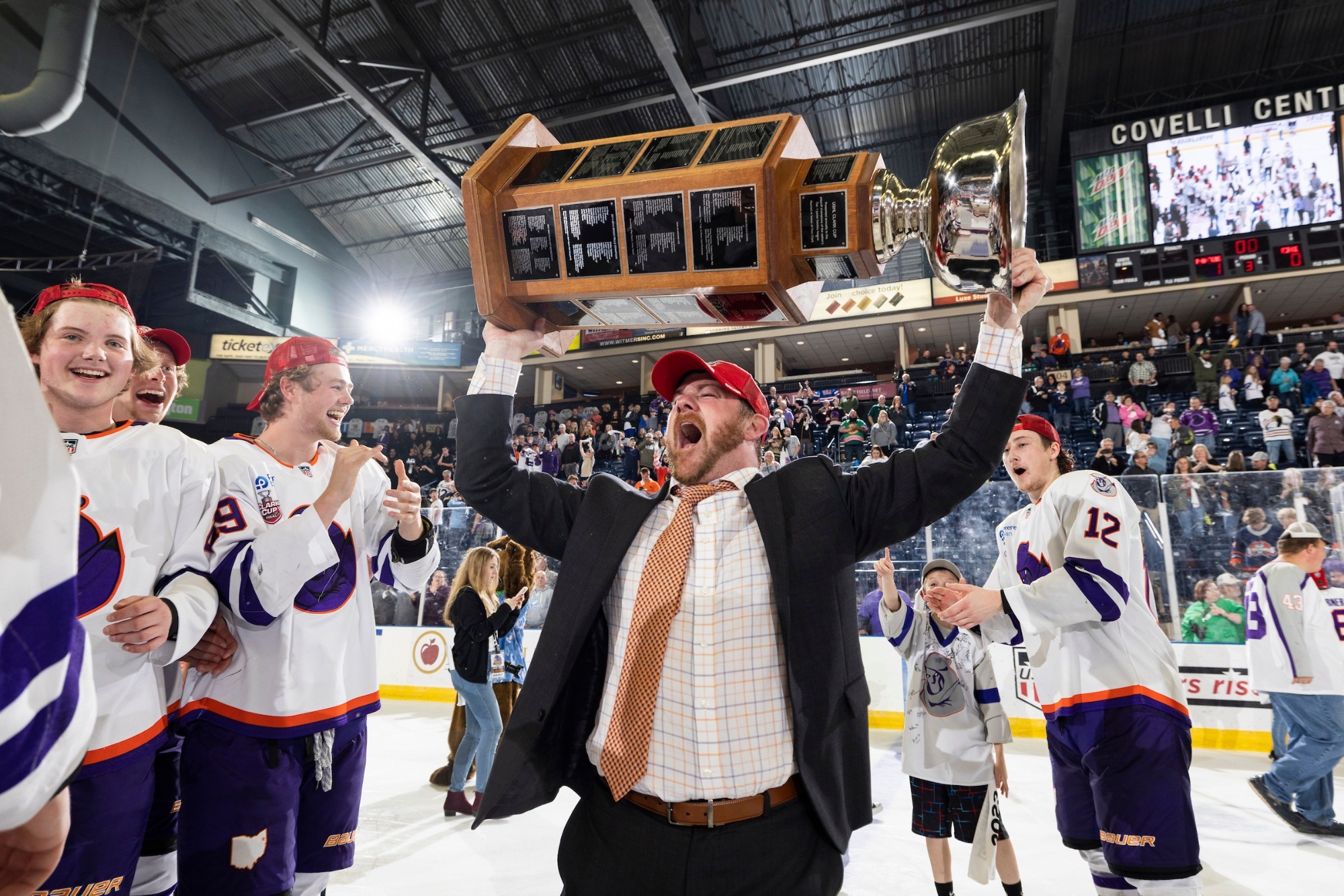 COACH WARD CELEBRATING WITH THE CLARK CUP