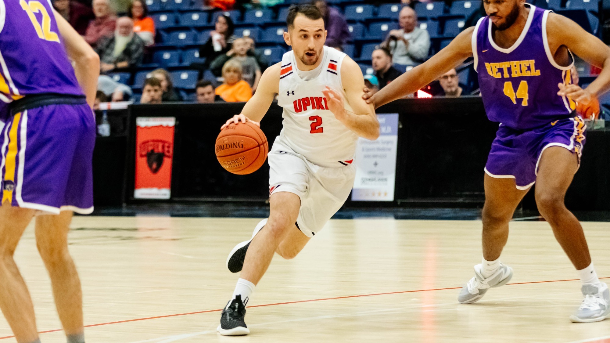 Korbin Spencer Men's Basketball UPIKE Athletics